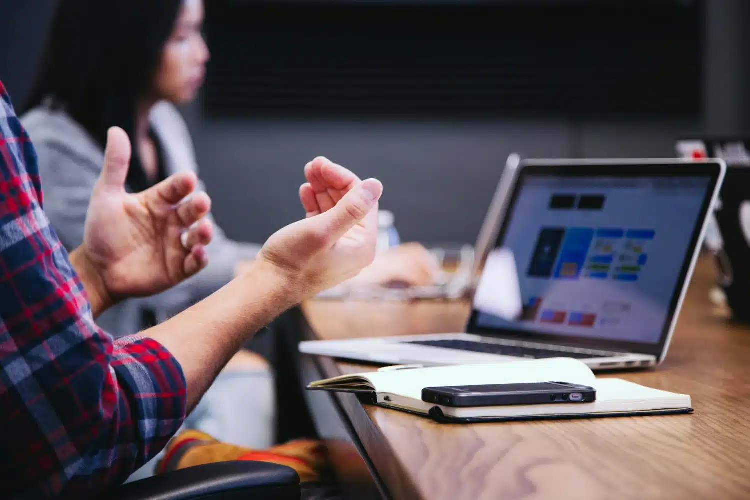 Person discussing ideas in meeting